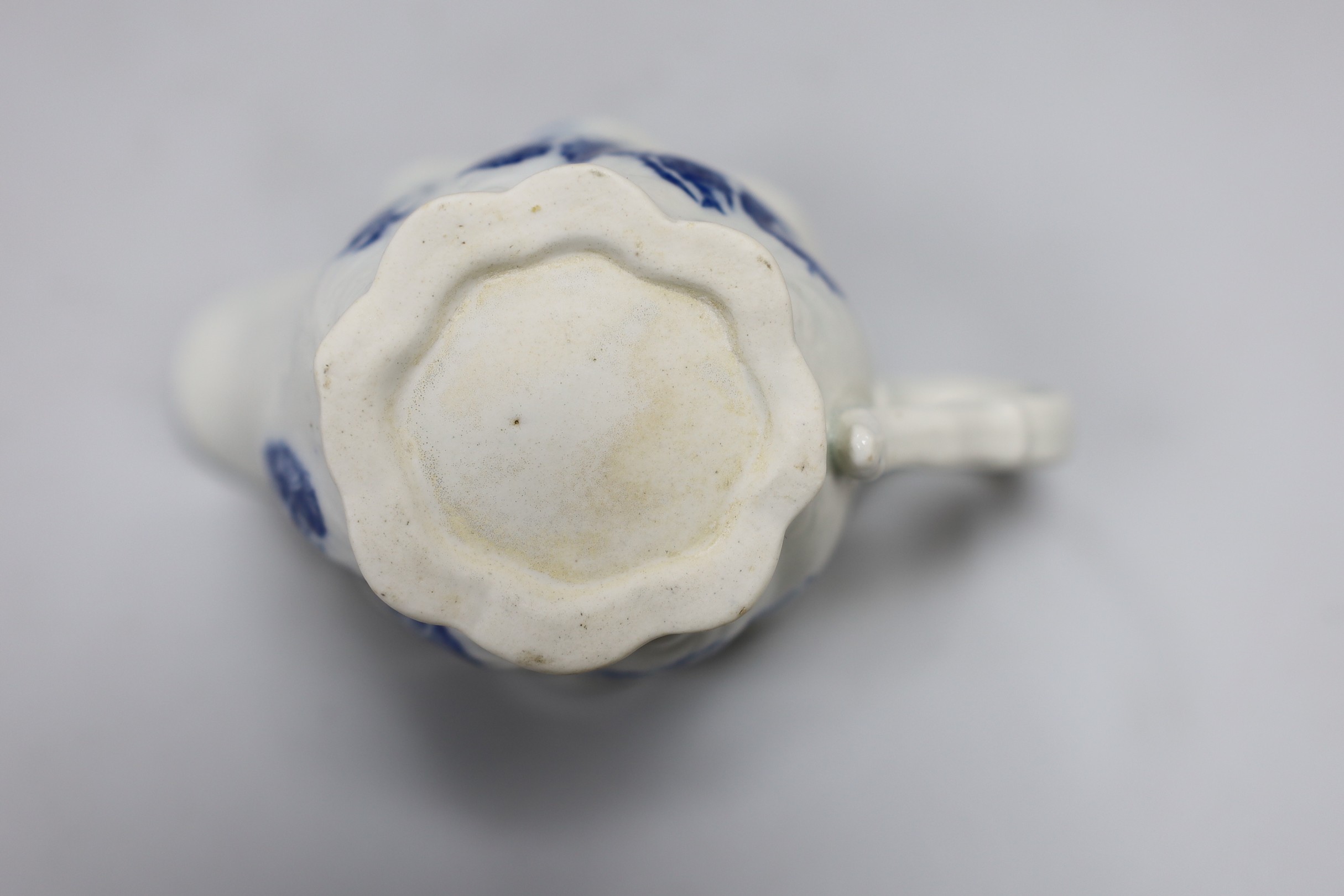 An 18th century Caughley Low Chelsea ewer printed with flowers, 6.5 cms high
